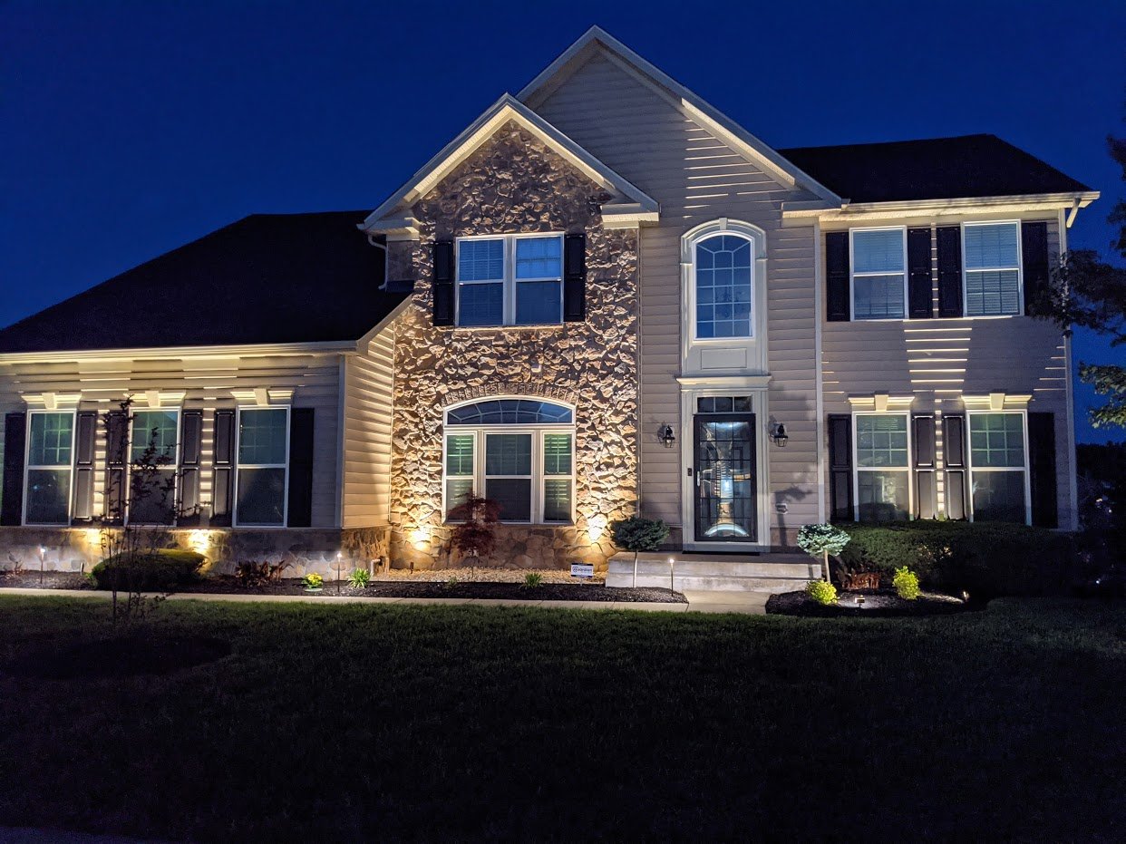Technician repairing residential sprinkler irrigation system in Northern Virginia