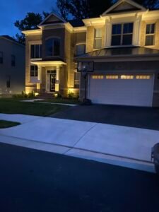 Technician repairing residential sprinkler irrigation system in Northern Virginia