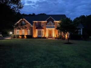 Technician repairing residential sprinkler irrigation system in Northern Virginia