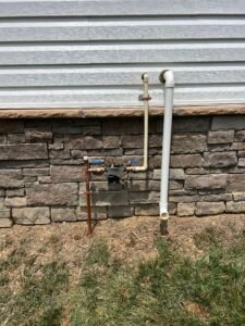 Technician testing an irrigation backflow prevention device